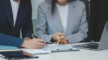 Business team collaboration discussing working analyzing with financial data and marketing growth report graph in team, presentation and brainstorming to strategy planning making profit of company. video