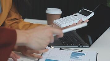 Business team collaboration discussing working analyzing with financial data and marketing growth report graph in team, presentation and brainstorming to strategy planning making profit of company. video