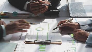 Business team collaboration discussing working analyzing with financial data and marketing growth report graph in team, presentation and brainstorming to strategy planning making profit of company. video