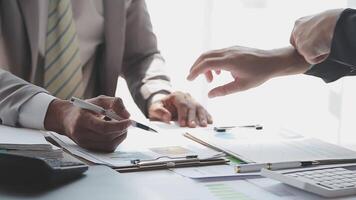 Business team collaboration discussing working analyzing with financial data and marketing growth report graph in team, presentation and brainstorming to strategy planning making profit of company. video