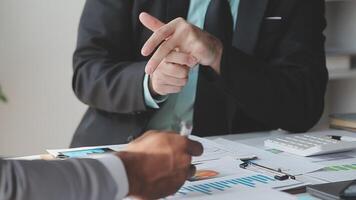 Business team collaboration discussing working analyzing with financial data and marketing growth report graph in team, presentation and brainstorming to strategy planning making profit of company. video