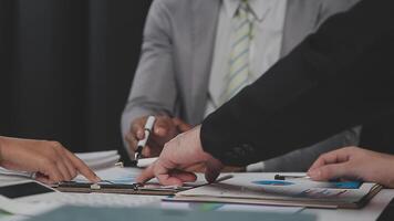 Business team collaboration discussing working analyzing with financial data and marketing growth report graph in team, presentation and brainstorming to strategy planning making profit of company. video