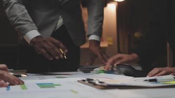 Business team collaboration discussing working analyzing with financial data and marketing growth report graph in team, presentation and brainstorming to strategy planning making profit of company. video