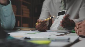 Business team collaboration discussing working analyzing with financial data and marketing growth report graph in team, presentation and brainstorming to strategy planning making profit of company. video