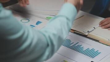 Business team collaboration discussing working analyzing with financial data and marketing growth report graph in team, presentation and brainstorming to strategy planning making profit of company. video