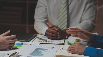 Business team collaboration discussing working analyzing with financial data and marketing growth report graph in team, presentation and brainstorming to strategy planning making profit of company. video