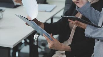 Business team collaboration discussing working analyzing with financial data and marketing growth report graph in team, presentation and brainstorming to strategy planning making profit of company. video