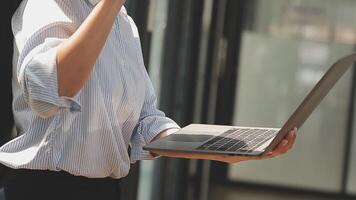 Asian Businesswoman Using laptop computer and working at office with calculator document on desk, doing planning analyzing the financial report, business plan investment, finance analysis concept. video