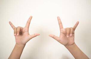 Hand pointing at something and make a sign on white background photo