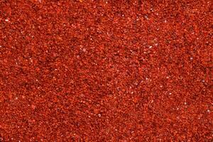 Background texture of chili powder and red cayenne pepper. photo