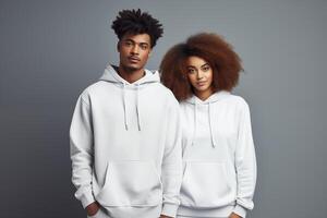 AI generated Young african american couple in blank white hoodie on gray background for clothing mockup photo