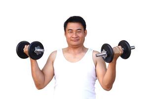 Asian man is lifting dumbbell for exercise. Concept, Exercise for health bodybuilding. Strengthen muscle. Weight lifting. Healthy lifestyle. Work out make strong of body. photo