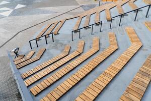 The street stage is an amphitheater, benches for sitting, a place for resting citizens, no people, the design of the city park, an observation deck, a place for spectators benches. photo