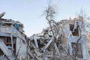 An earthquake in the city destroyed the building. The collapse of a brick house, the walls collapsed after the explosion, the destruction of private property. photo