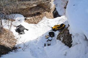 Camp for cooking in a snow shelter. Winter hike in the highlands. Tourist utensils. photo