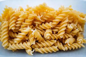 Pasta view from above. Close-up of pasta. Wheat food, yellow color. photo