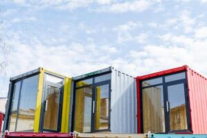 The boutique store is made of sea containers, the design project of the shopping complex on the street. Euro doors are plastic windows. photo