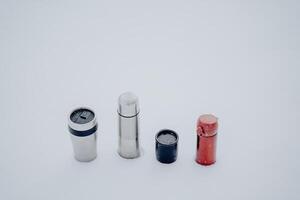 Vacuum thermoses of different types and sizes. Metal bottles for hot. photo