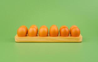 Chicken eggs, high protein breakfast, orange egg shells photo