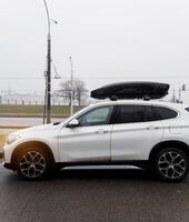 Minsk, Belarus, March 4, 2024 - luxury BMW with roof rack photo