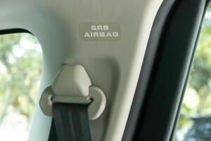 Supplemental Restraint System airbag sign or sticker in a car. photo