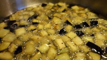 diced aubergines with a little salt that fry in a saucepan video