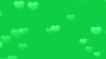 amor forma, corazón forma brillante bokeh cubrir animación efecto en verde pantalla antecedentes video