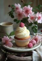 AI generated Cupcake with raspberry on plate. A small cupcake sits beside some tea and flowers photo