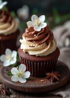 AI generated Chocolate cupcakes with cream and cherry blossoms on wooden background photo