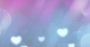 Animated love hearts on pink and blue colorful blurred background for Valentine's Day celebration. video