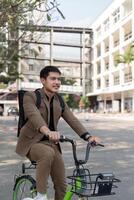 The businessman eco friendly transportation, cycling through the city avenues to go to work. sustainable lifestyle concept photo