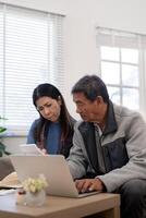 Serious stressed asian senior old couple worried about bill discuss unpaid bank debt paper payment worry about money problem photo