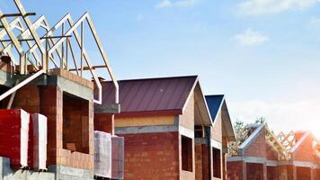 Single-family house under construction in an development estate of small single-family houses. photo