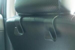 Accessories for hanging items or bag behind the car seat photo