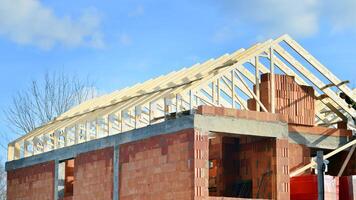 Single-family house under construction in an development estate of small single-family houses. photo