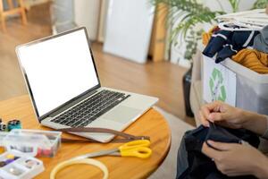 Young female with laptop at home on white blank screen for montage mockup display device in concept of lifestyle work at home with digital technology photo