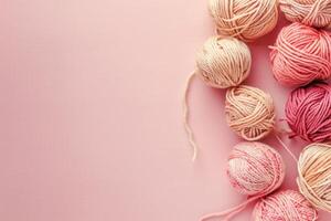 AI generated Pink balls of woolen threads on a light pink background with copy space photo