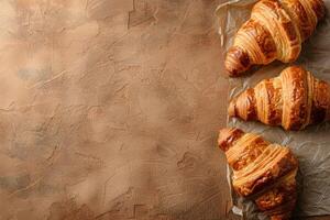 AI generated Croissants on a beige textured background with copy space. Homemade baking photo