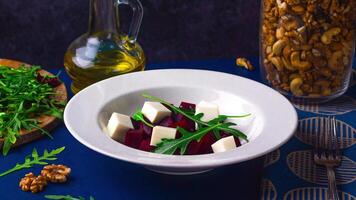 Recipe for simple, healthy, beetroot fitness salad. Beetroot, Feta Cheese, Arugula, Nuts, Olive Oil. Creative video stop motion animation 4k