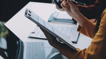 Finance manager meeting discussing company growth project success financial statistics, professional investor working start up project for strategy plan with document, laptop and digital tablet. video