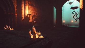 A group of lit candles illuminating a dark room in a temple video