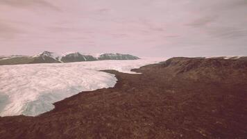 A majestic glacier surrounded by towering mountains video