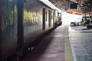 Kathgodam, Uttarakhand, India, September 25 2023 - Indian railway train at Kathgodam railway station platform during morning time, Colourful train at Kathgodam, Uttarakhand railway station photo