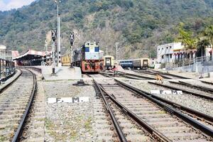 View of train Railway Tracks from the middle during daytime at Kathgodam railway station in India, Train railway track view, Indian Railway junction, Heavy industry photo
