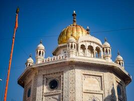 View of details of architecture inside Golden Temple - Harmandir Sahib in Amritsar, Punjab, India, Famous indian sikh landmark, Golden Temple, the main sanctuary of Sikhs in Amritsar, India photo