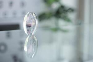 Glasses lenses on the table in optic, eyeglasses lenses photo