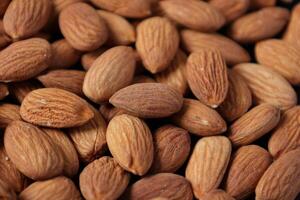 Closeup of almond, nut food, brown almonds photo