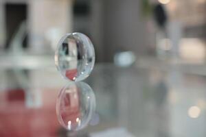 Glasses lenses on the table in optic, eyeglasses lenses photo