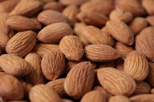 Closeup of almond, nut food, brown almonds photo