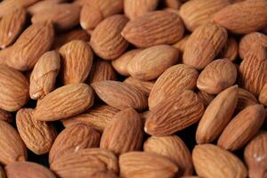 Closeup of almond, nut food, brown almonds photo